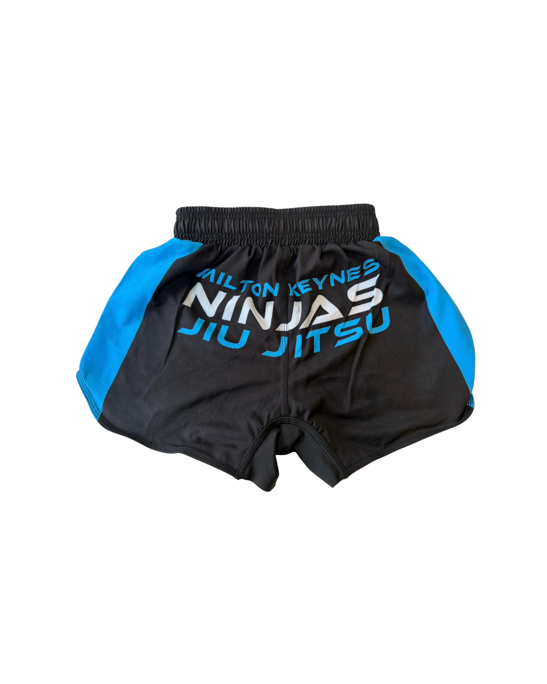 Black and blue martial arts shorts with 'Milton Keynes Ninjas Jiu Jitsu' text